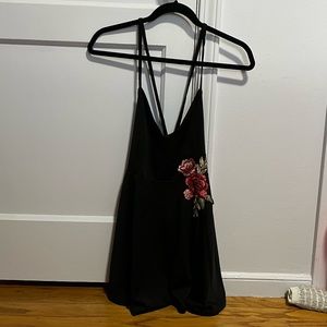 Black criss cross back dress w/ embroidered flower